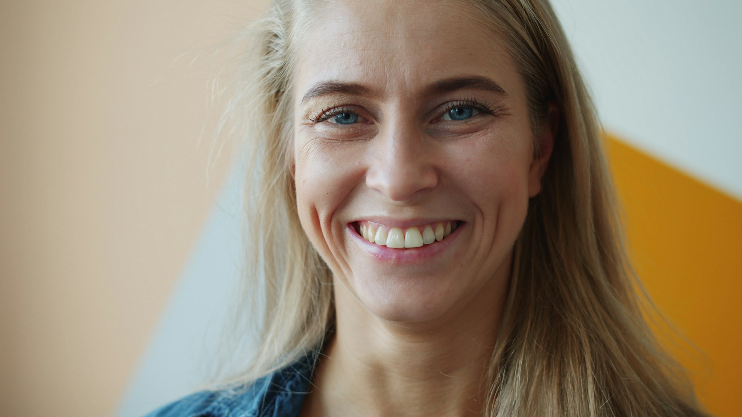 Woman in her forties smiling warmly