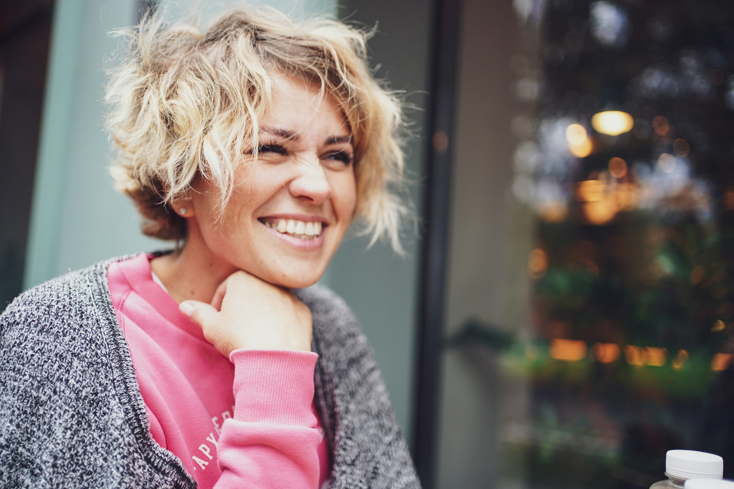Woman with curly hair smiling