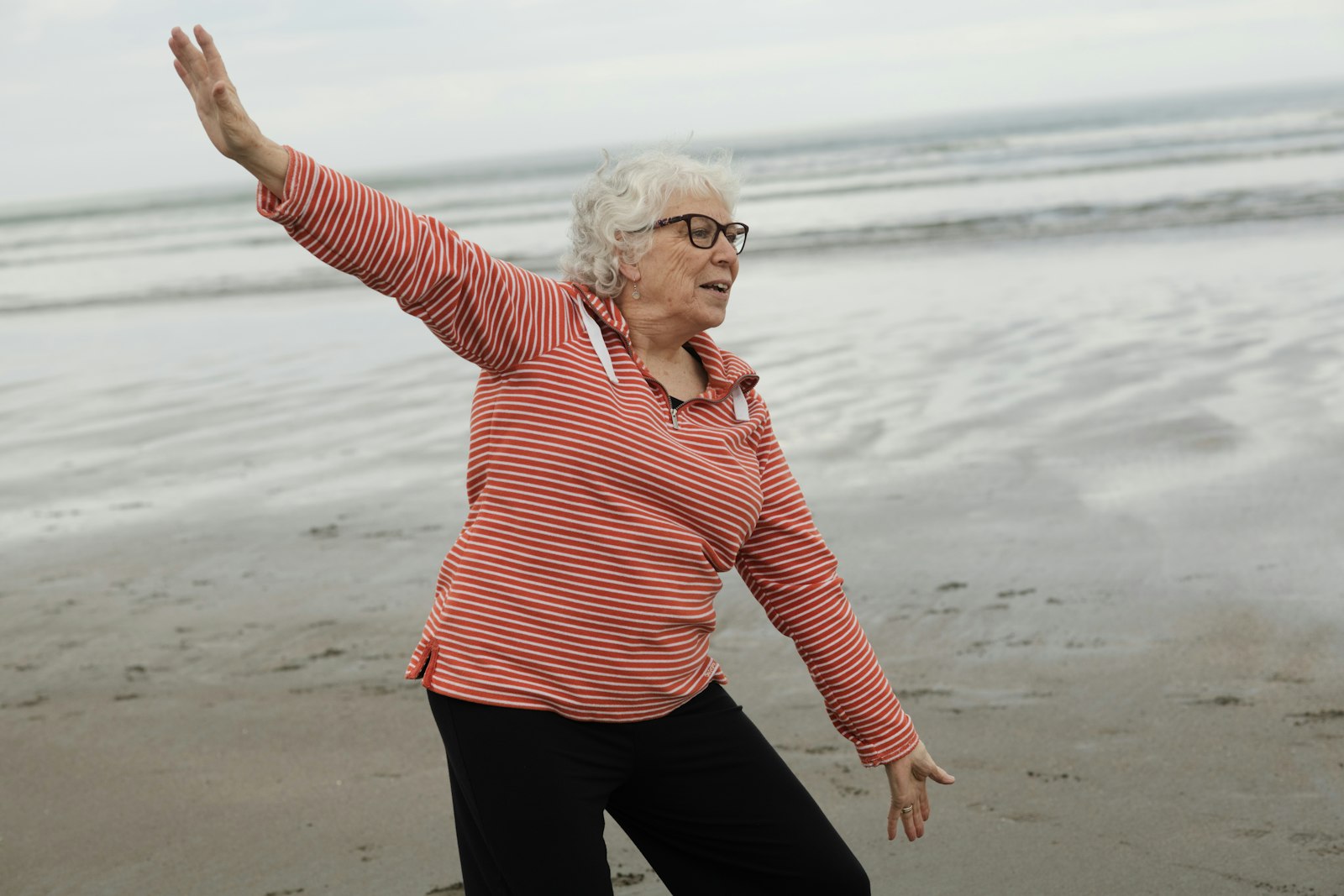 Woman dancing on the beach